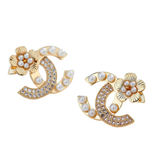 Load image into Gallery viewer, Flower Pearl Romance Stud Earrings.  Exclusive designer inspired flower pearl and studded earrings. The most romantic accessory for every outfit of the day. Limited quantities. Available in Silver and Gold.  2 cm    Please follow care instructions to maintain your pieces quality and integrity. #shopemmasofia
