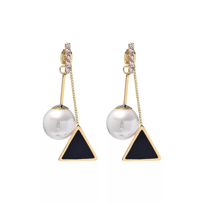 Pearl Tuxedo Earrings. Dazzling tuxedo style pearl triangle dangle earrings. Great for dressing up any look any day of the week!   Chain 3.0 cm  Pearl 1.0 cm  Triangle 1.5 cm      Please follow care instructions to maintain your pieces quality and integrity. #ShopEmmaSofia 