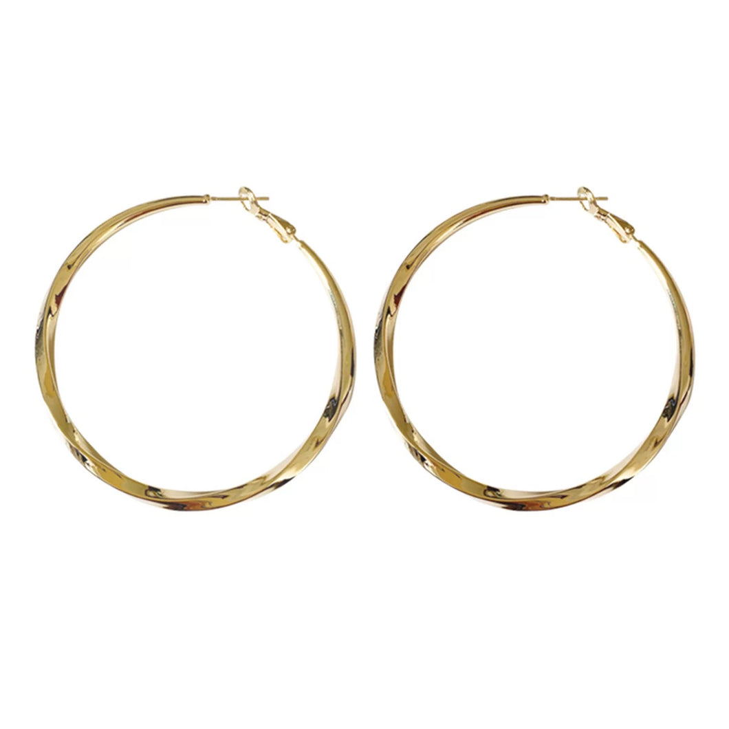 Twisted Hoop Earrings.  Classic and sexy gold plated hoop earrings with a twist! They go with everything and you can never have too many hoops. Available in gold.  6 cm    Please follow jewelry care instructions to maintain your pieces quality and integrity. #shopemmasofia